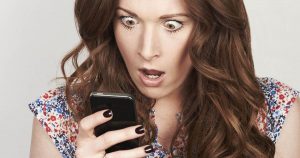 a-shocked-woman-looking-at-her-phone-1530303366090-300x158.jpg