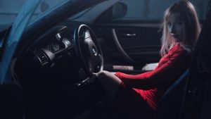girl_in_car_in_a_red_dress_behind_the_wheel_blonde_makeup_woman_model_photo-1551767698520-300x169.jpg