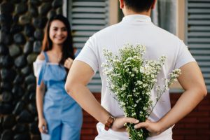 man-holding-baby-s-breath-flower-in-front-of-woman-standing-935789-300x200.jpg