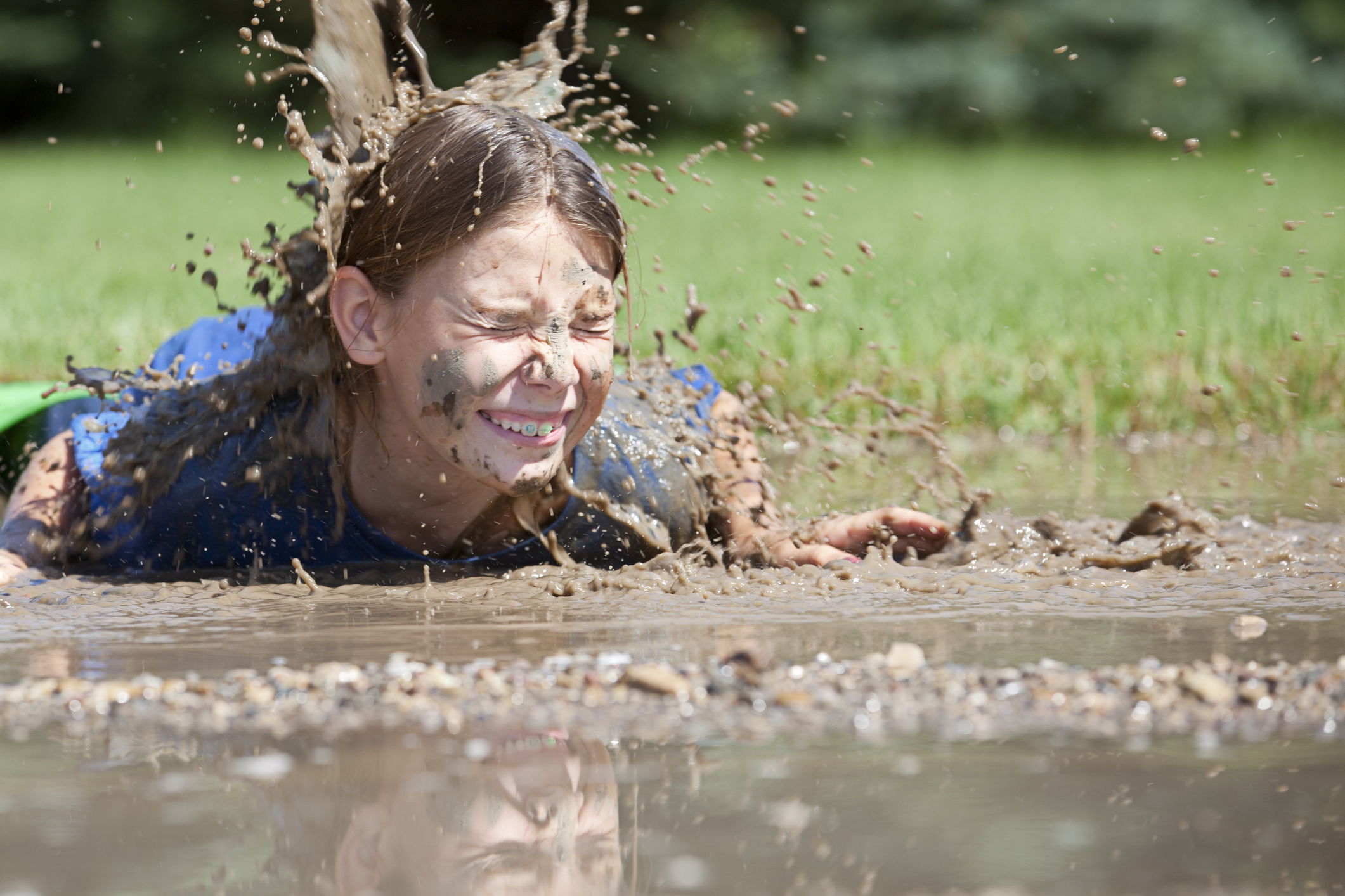 Girl Fall into a mud puddle.