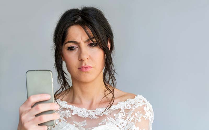 11-Sad-and-Angry-Bride-with-Mobile-Phone-in-the-Hand.jpg